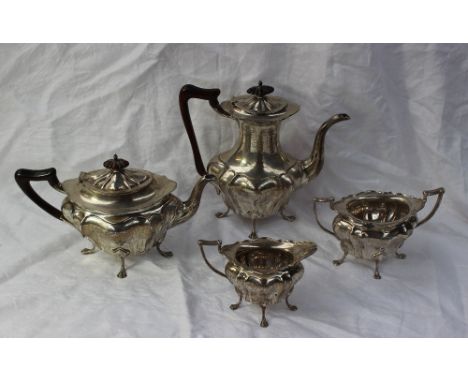 A George V silver four piece teaset, of oval shape, comprising a hot water jug, teapot, cream jug and sugar basin, Sheffield,