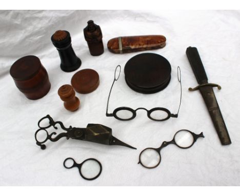 A fruitwood snuff box in the form of a lady together with candle snuffer, dagger, tortoiseshell glasses case, glasses, turned