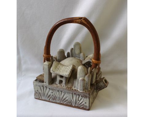 Ian Godfrey, a studio pottery teapot in the form of a settlement surrounding a mound, with a bamboo handle, 13cm x 10.5cm CON