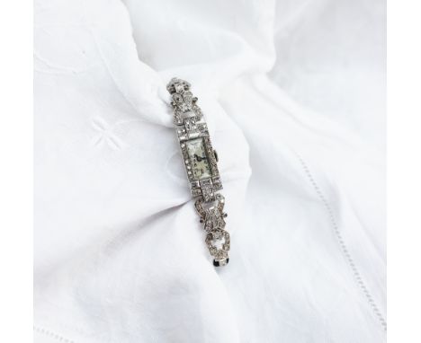 An Art Deco style diamond set cocktail watch set with baguette and old cut diamonds to a white metal case marked platinum, ha