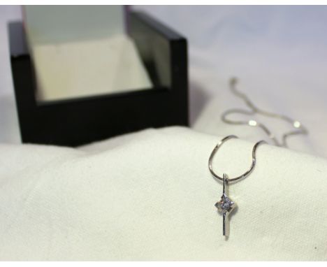 An 18ct white gold single stone diamond pendant set with a princess cut diamond approximately 0.45 of a carat on an 18ct whit