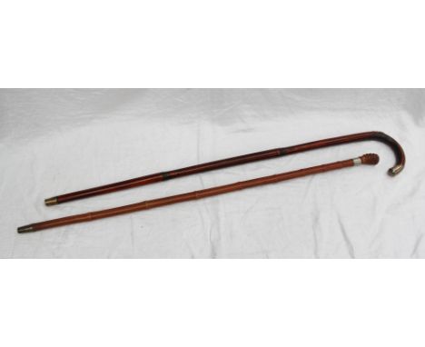 An early 20th Century Swaine & Adeney horse measuring cane. The bamboo sheath, revealing a brass mounted measuring cane, with