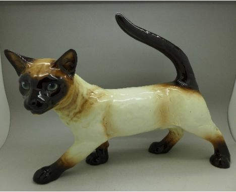A Goebel model of a Siamese cat, 33cm wide