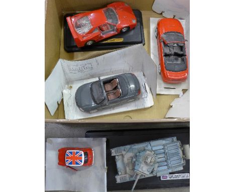 Four die-cast scale model vehicles, Maisto, Burago and a scale model of a tank