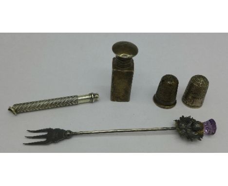 A small silver scent, two silver thimbles, a silver fork and a pencil