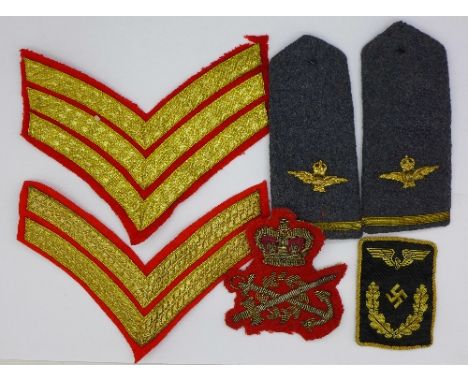 Cloth badges and epaulets including a German patch