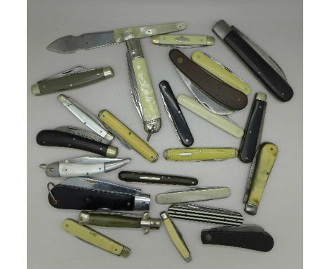 A collection of knives including one with blade marked The Docker and one with fork