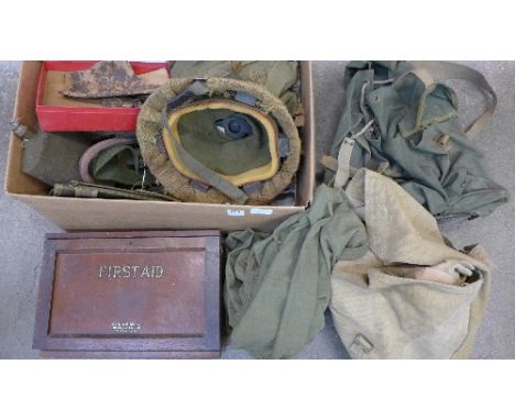 Military related items including uniforms, helmet, leathers, a flask, shrapnel, dug up near Basselle, Somme, a Boots first ai