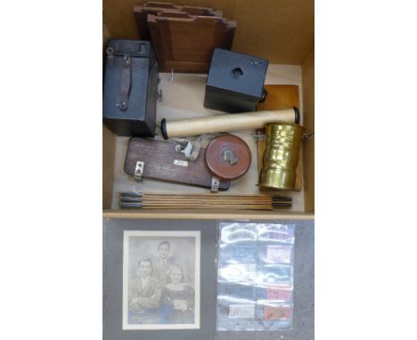 Two box cameras, a brass trench art vase, leather covered tape measure, two tie presses, etc.