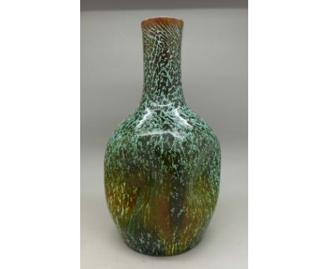 A Linthorpe pottery vase designed by Christopher Dresser, c.1880, mottled green and brown glaze and dimpled body, small chip 