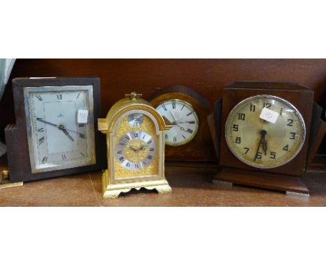 Four clocks including Haller with Art Deco case, inlaid clock lacking one foot