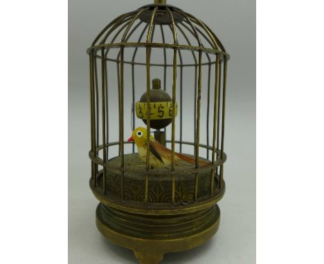 An automaton clock, height with handle 14cm