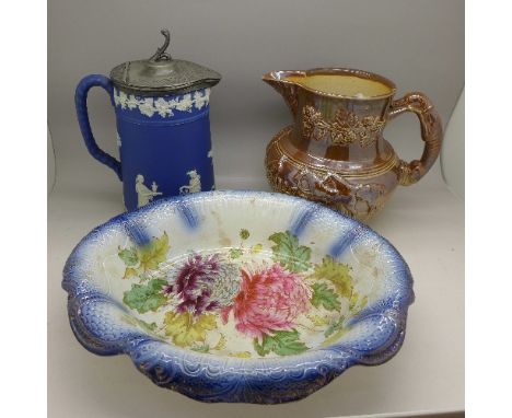A dark blue Jasperware jug with pewter lid, a relief moulded jug with hunting scene, a/f, and a dish with crystanthemum decor