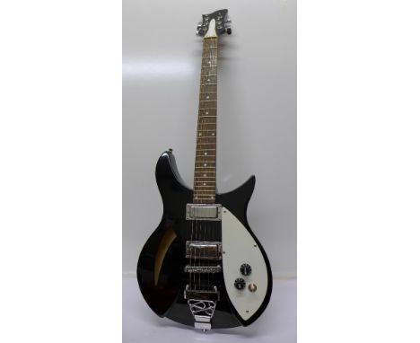 A short scale, small bodied, Rickenbacker style set neck, hollow body electric guitar in piano black