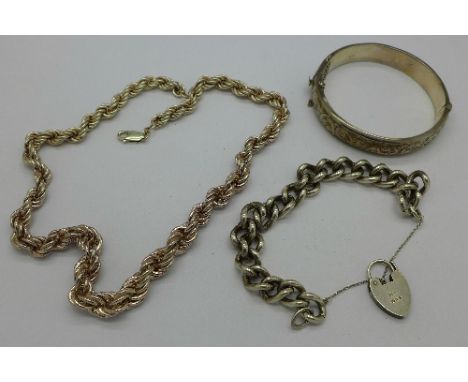 A heavy silver bracelet, a silver neck chain and a silver bangle, 111g