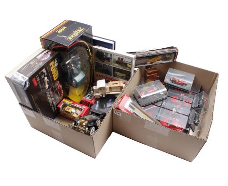 2 boxes with scale model cars and books about cars