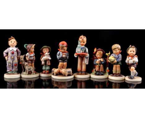 8 Goebel Hummel earthenware statues, largest 15 cm high (statue of waiter with bottle glued to glass tray)