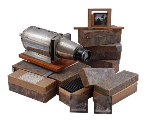 Metal magic lantern, 50 cm long and 8 boxes with glass pictures, of which 7 boxes with images from various countries and 1 wi