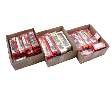 3 boxes with Herpa scale model trucks
