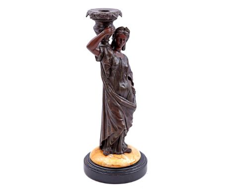 Unclearly signed, zamak candlestick in the shape of a woman with dress on marble and blackened wooden base, France 19th centu