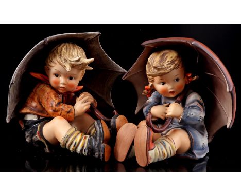 2 Goebel Hummel earthenware statues of a boy and girl under umbrella, numbers 152 A and 152 B, 19 cm high