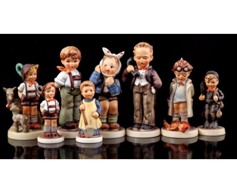 9 Goebel Hummel earthenware figurines of boys, largest 15 cm high