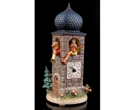 Goebel Hummel earthenware clock tower containing figures and battery clockwork, from the Century Collection, Hum 441, year 19
