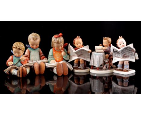 6 Goebel Hummel earthenware figurines of reading boys and girls, largest 14 cm high (reading girl has a chip on the edge of t