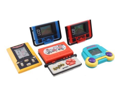 Vintage computer games / LCD Electronic Games Including Mini-Munchman, Bankraid and Invaders. From the 80s, except Invaders (
