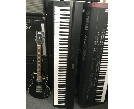 A boxed Casio Privia digital piano and stand (2).