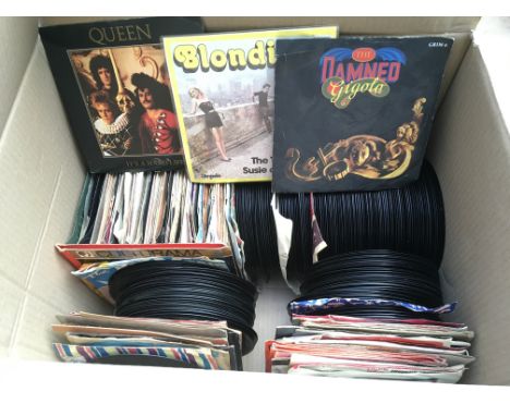 A box of 7" singles and EPs by various artists including Elvis Presley, The Who, The Rolling Stones and many more.