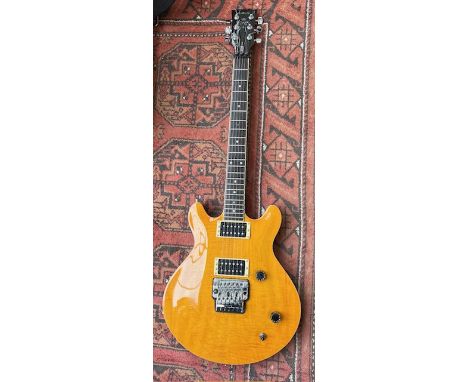 A 2000 Yamaha MSG Deluxe electric guitar with Yellow Flame Top HB Pickups and locking vibrato tremolo system. Good condition 