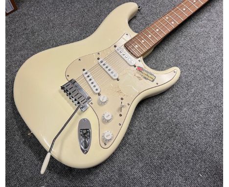 This is an unplayed 2003 Fender Stratocaster in faded Olympic White finish - cream. Rosewood board. This is a completely unpl
