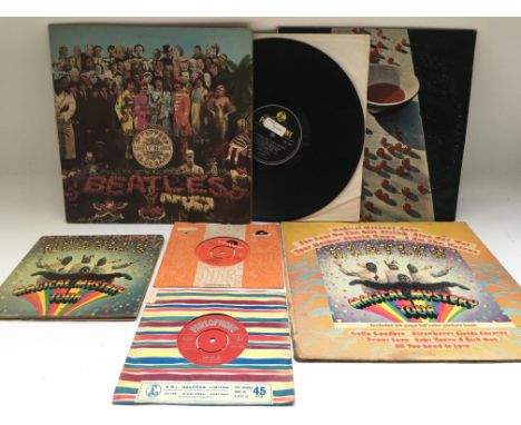 A small collection of Beatles and related 7" singles, EP and LPs comprising a first UK pressing of 'Love Me Do', one small fe