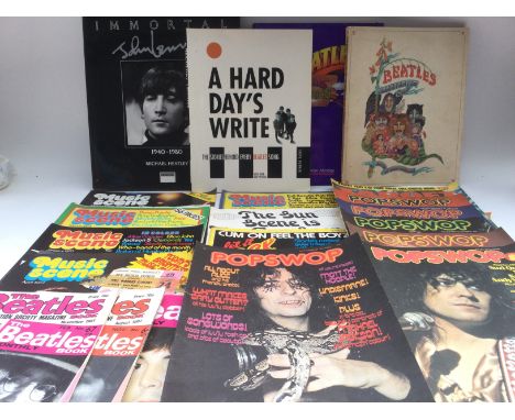 A case of music ephemera including a signed Slade publicity card, press photos, vintage music publications including NME, Sou