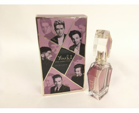 A fully signed One Direction 50ml 'You & I' perfume. In 2014 the vendor was gifted the item by Mike Edwards who was involved 