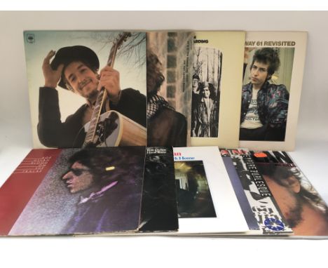 Two bags of 18 Bob Dylan LPs comprising 'Blonde On Blonde', ' Highway 61 Revisted', 'Nashville Skyline' and others.