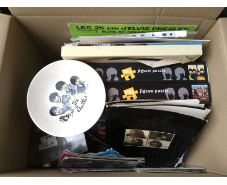 Two boxes of music ephemera comprising mainly Beatles related items including a Beatles Get Back book in very poor condition,