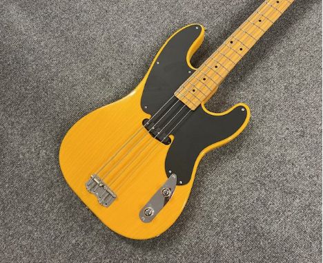 A Fender MIJ Made in Japan T Type Precision Bass guitar in blonde finish and in very good overall largely unplayed condition.