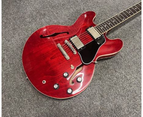 A 2021 Gibson ES 335 Electric Guitar in Cherry with Original Gibson Brown Case. Overall very good condition with very light p