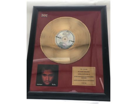 A framed and glazed limited edition gold disc and CD display in recognition for worldwide sales of the No Jacket Required alb