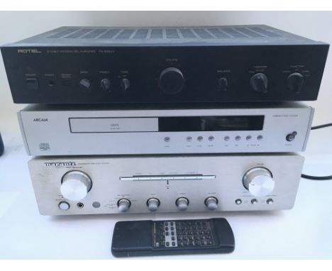 A Marantz PM7001 amplifier, a Pioneer PL-514 turntable, an Arcam CD73 CD player and a Rotel RA-930AX amplifier. Includes a Ma