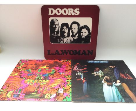 A first UK pressing of 'Last Exit' by Traffic, 'Disraeli Gears' by Cream and 'L.A. Woman' by The Doors. Condition generally E