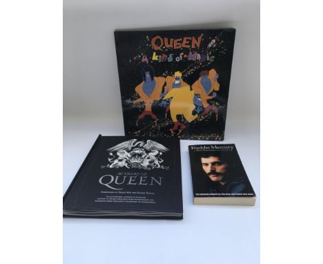 A 40 Years of Queen book complete with inserts, a Freddie Mercury autobiography and 'A Kind Of Magic' LP (3).