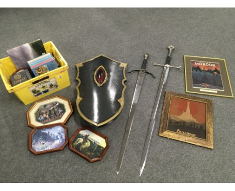 A collection of 'Lord Of The Rings' items comprising two swords, a shield etc.