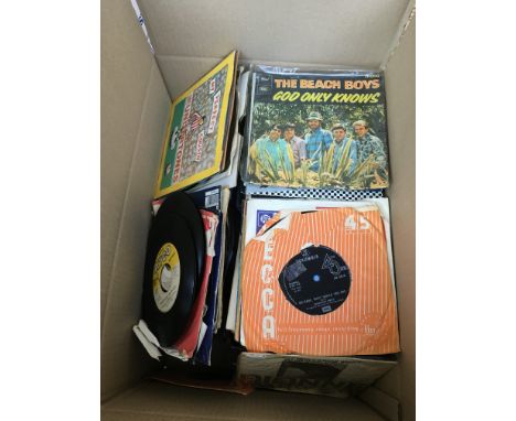 A box of 7" singles and EPs by various artists including The Beatles, Depeche Mode, The Undertones, Aztec Camera and many mor