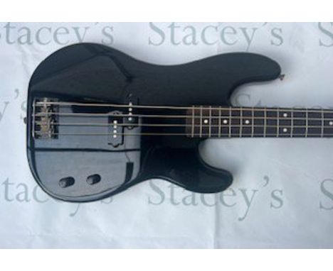 A 2002 Fender Japan Aerodyne Precision Bass Guitar in black with gold decal. This bass is in nearmint unplayed condition with