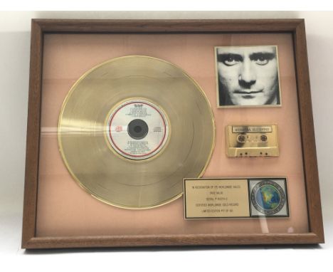 A framed and glazed limited edition gold disc, CD and cassette display in recognition for worldwide sales of the Face Value a