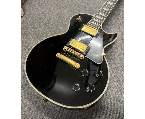 A 1999 Gibson Les Paul Custom electric guitar in Black with Gold Plated parts. Comes with original Gibson Brown Case. In good
