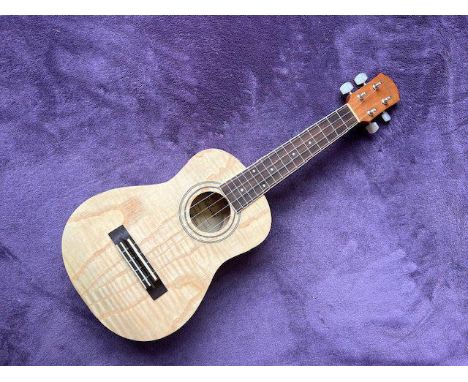 An Ashbury Ukelele in blonde natural finish very good condition with very little wear